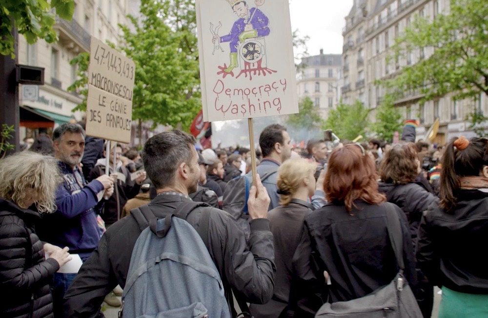 Democracy Washing protest sign, May Day, Paris